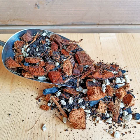 A scoop of chunky potting mix